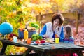 Mother and daughter set table for picnic in autumn Royalty Free Stock Photo