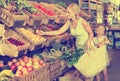 Mother with daughter shopping fruits Royalty Free Stock Photo