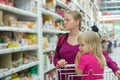 Mother and daughter shopping in supermarket Royalty Free Stock Photo