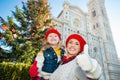 Mother and daughter showing thumbs up in Christmas Florence Royalty Free Stock Photo