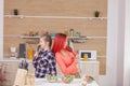 Mother and daughter singing on kitchen intruments