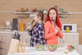 Mother and daughter singing on kitchen intruments