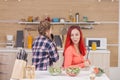 Mother and daughter singing on kitchen intruments