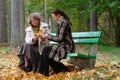 Mother and daughter sitting on a bench