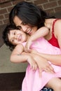 Mother and daughter sitting at the doorstep Royalty Free Stock Photo