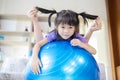 Mother and daughter smiles, they are with a big wind ball