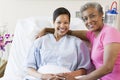 Mother And Daughter Smiling In Hospital