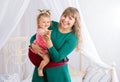Mother and daughter smiling and looking Royalty Free Stock Photo