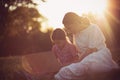 Mother and daughter spending time outside using laptop Royalty Free Stock Photo