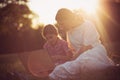 Mother daughter spending time outside. Using laptop Royalty Free Stock Photo