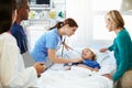 Mother And Daughter With Staff In Intensive Care Unit Royalty Free Stock Photo