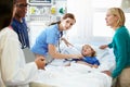 Mother And Daughter With Staff In Intensive Care Unit Royalty Free Stock Photo