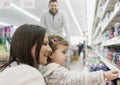 Family buying groceries in the local supermarket Royalty Free Stock Photo