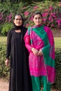 Mother and daughter standing at Qutub Minar, Delhi, India