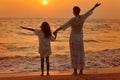 Mother and daughter standing on seashore Royalty Free Stock Photo
