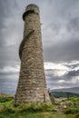 Mother and daughter standing on the stairs of old and abandoned stone chimney in Lead Mines, Ireland Royalty Free Stock Photo