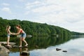 Mother and daughter in stone in lake Royalty Free Stock Photo
