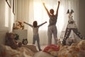 Mother and daughter stretch themselves after waking up in the