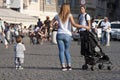 Mother with daughter and stroller