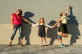 Mother and daughter students holding hands go to school. Royalty Free Stock Photo