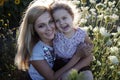 Mother and a daughter in the sunflowers Royalty Free Stock Photo