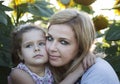 Mother and a daughter in the sunflowers Royalty Free Stock Photo