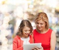 Mother and daughter with tablet pc computer Royalty Free Stock Photo