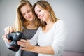 Mother and daughter taking photos and checking them Royalty Free Stock Photo