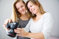 Mother and daughter taking photos and checking them Royalty Free Stock Photo