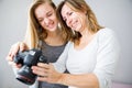 Mother and daughter taking photos