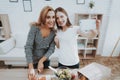 Mother and Daughter Taking Selfie in Kitchen.