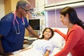 Mother And Daughter Talking To Male Nurse In Hospital Room Royalty Free Stock Photo