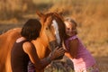 MOther and daughter with their handsome horse