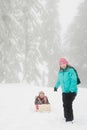 Mother and daughter with toboggan Royalty Free Stock Photo