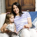 Mother with daughter together in bed smiling, happy family close up, lifestyle people concept, cool real modern family Royalty Free Stock Photo