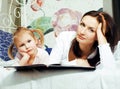 Mother with daughter together in bed smiling, happy family close up, lifestyle people concept, cool real modern family Royalty Free Stock Photo