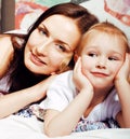 Mother with daughter together in bed smiling, happy family close up, lifestyle people concept, cool real modern family Royalty Free Stock Photo