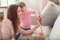 Mother and daughter together at home easter concept looking for