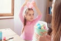 Mother and daughter together at home easter preparation in bunny ears Royalty Free Stock Photo