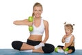 Mother with daughter train weights of apples