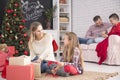 Mother and daughter unwrapping gifts