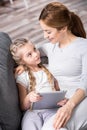 Mother and daughter using digital tablet Royalty Free Stock Photo