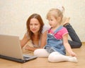 Mother and Daughter Using Laptop