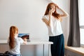 Mother and daughter using laptop computer at home Royalty Free Stock Photo