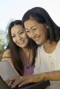 Mother And Daughter Using Laptop Outdoors Royalty Free Stock Photo