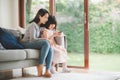 Mother and daughter using smartphone