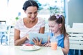 Mother and daughter using tablet computer together Royalty Free Stock Photo