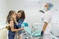 Mother and daughter visiting pediatric dentist at dental clinics