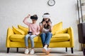 mother and daughter in vr headsets playing video games at home Royalty Free Stock Photo