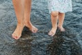 Mother and daughter walking along the seashore Royalty Free Stock Photo